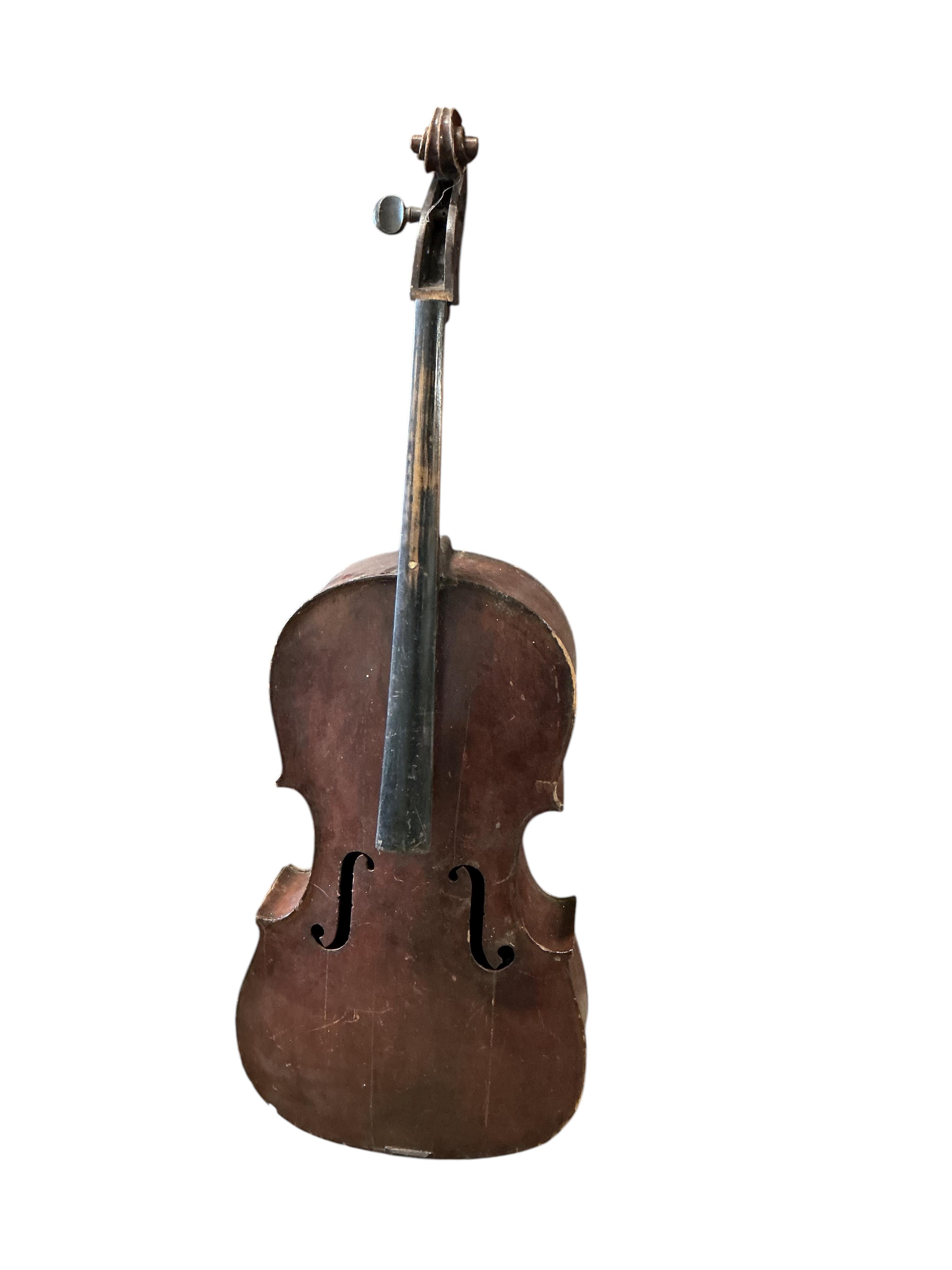 A small cello and assorted instruments in need of restoration